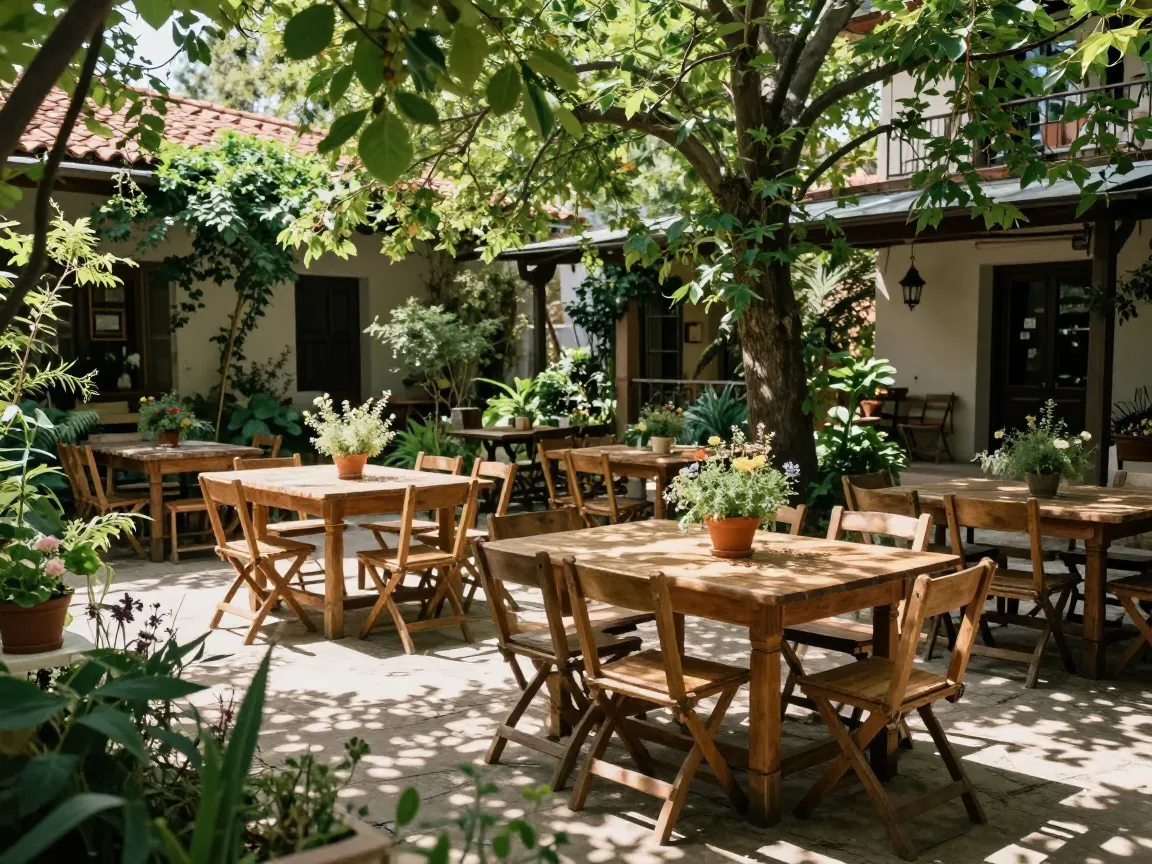 Rustic garden courtyard with wooden tables and chairs under trees, dappled sunlight, wedding venue.